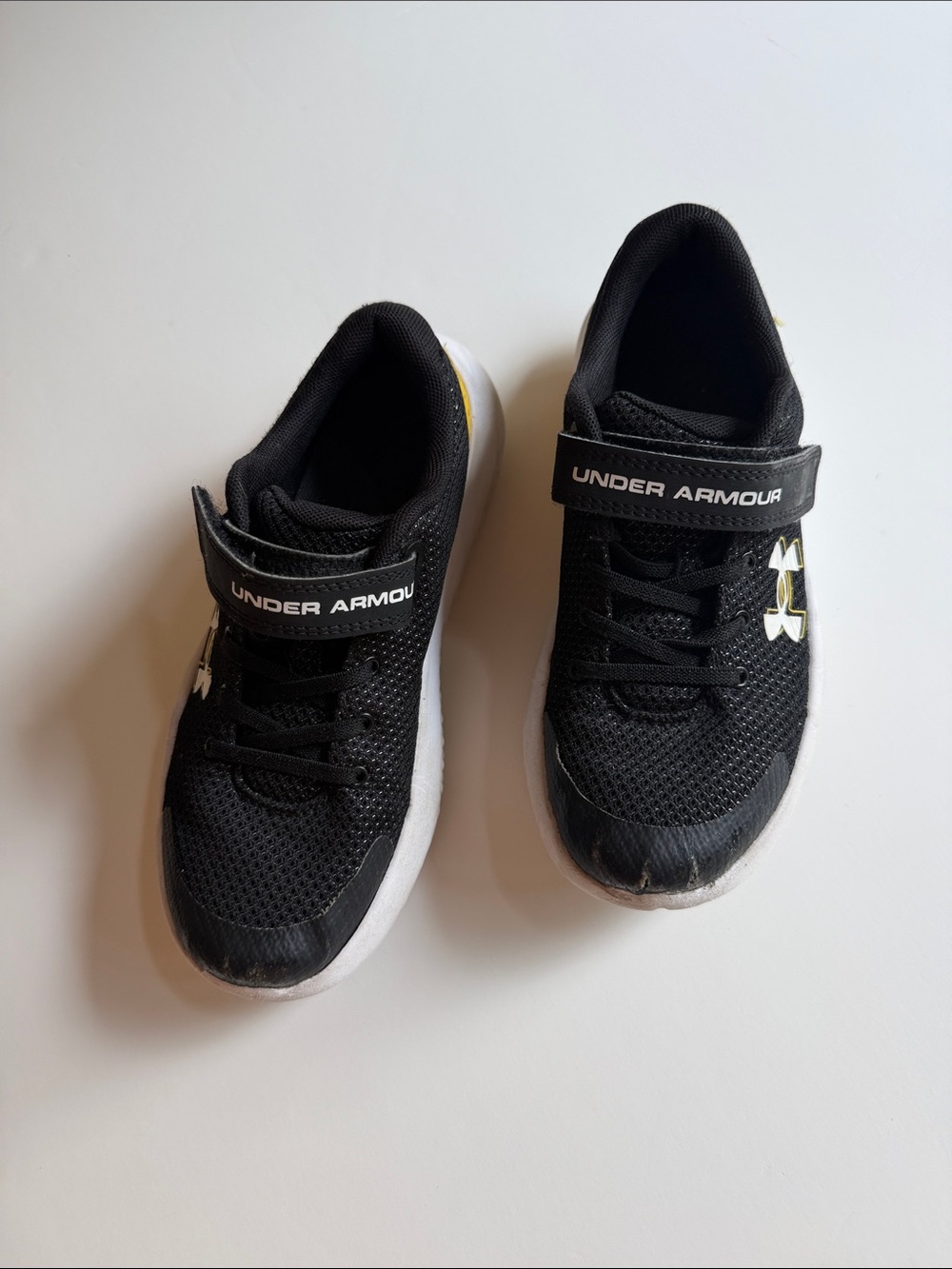 Under Armour Black and White Kids' Athletic Sneakers with Gold Logo